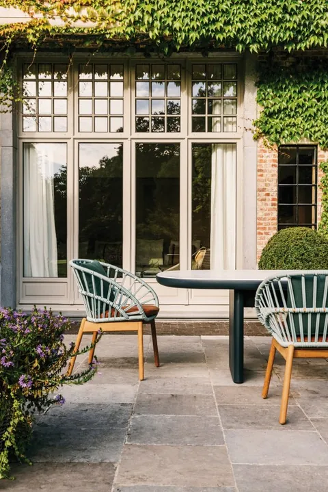 Kettal Cala outdoor furniture in use, catalog photograph