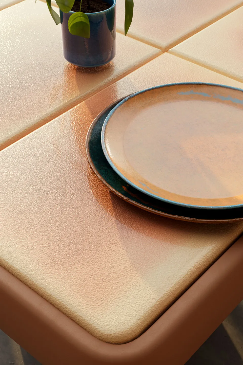 Kettal Insula outdoor furniture in use, catalog photograph