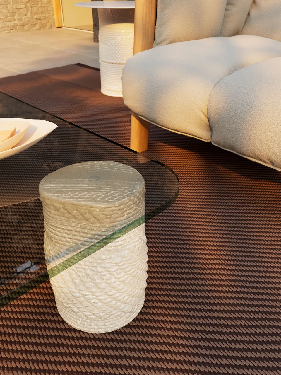 Kettal Plumon outdoor furniture in use, catalog photograph